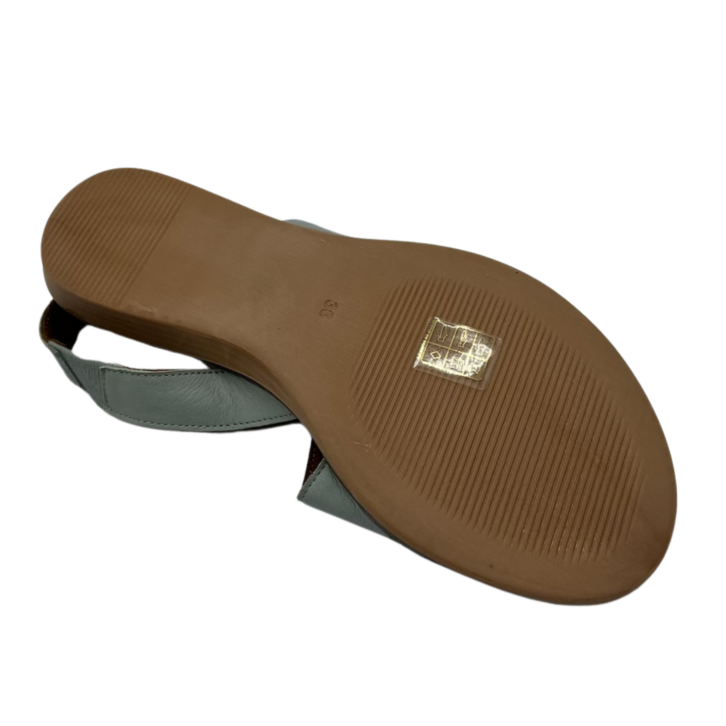 Bottom view of pale green leather sandal with slight wedge heel, rounded tow and slingback strap