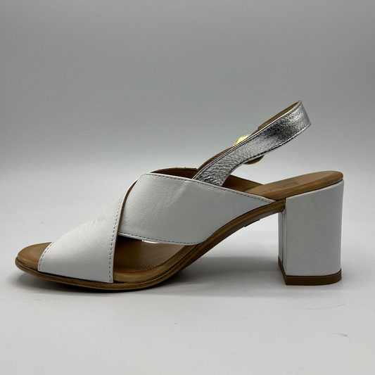 Left facing view of leather sandal with white straps. It has a block heel and a silver slingback strap