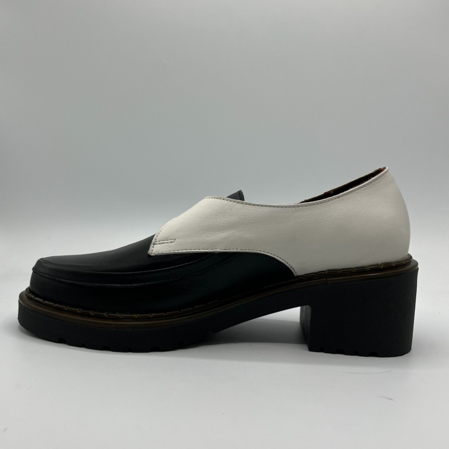 Black and white shoe on a gray background