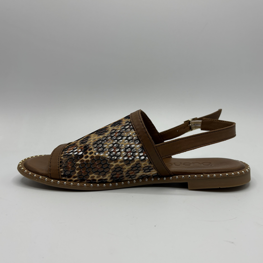 Brown sandal with leopard print strap on a gray background