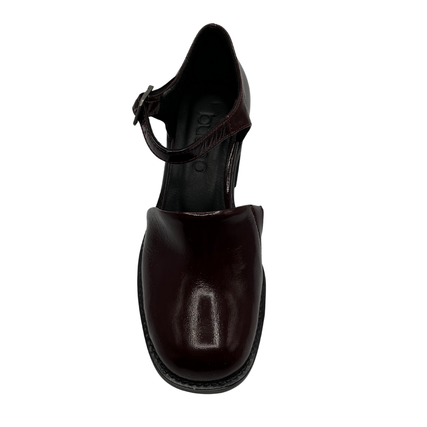 Top view of burgundy patent leather shoe with ankle strap, thick block heel and rounded toe.