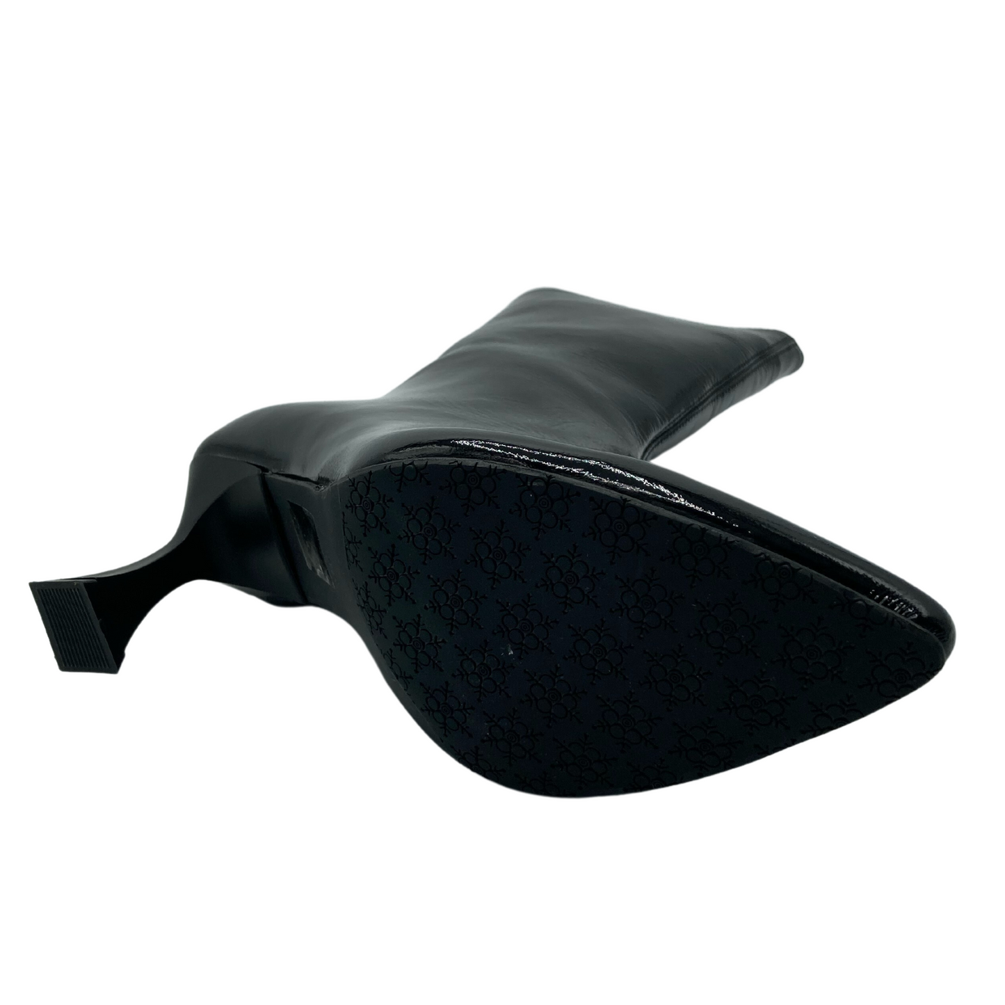 Bottom view of patent leather short boot with pointed toe and flared heel
