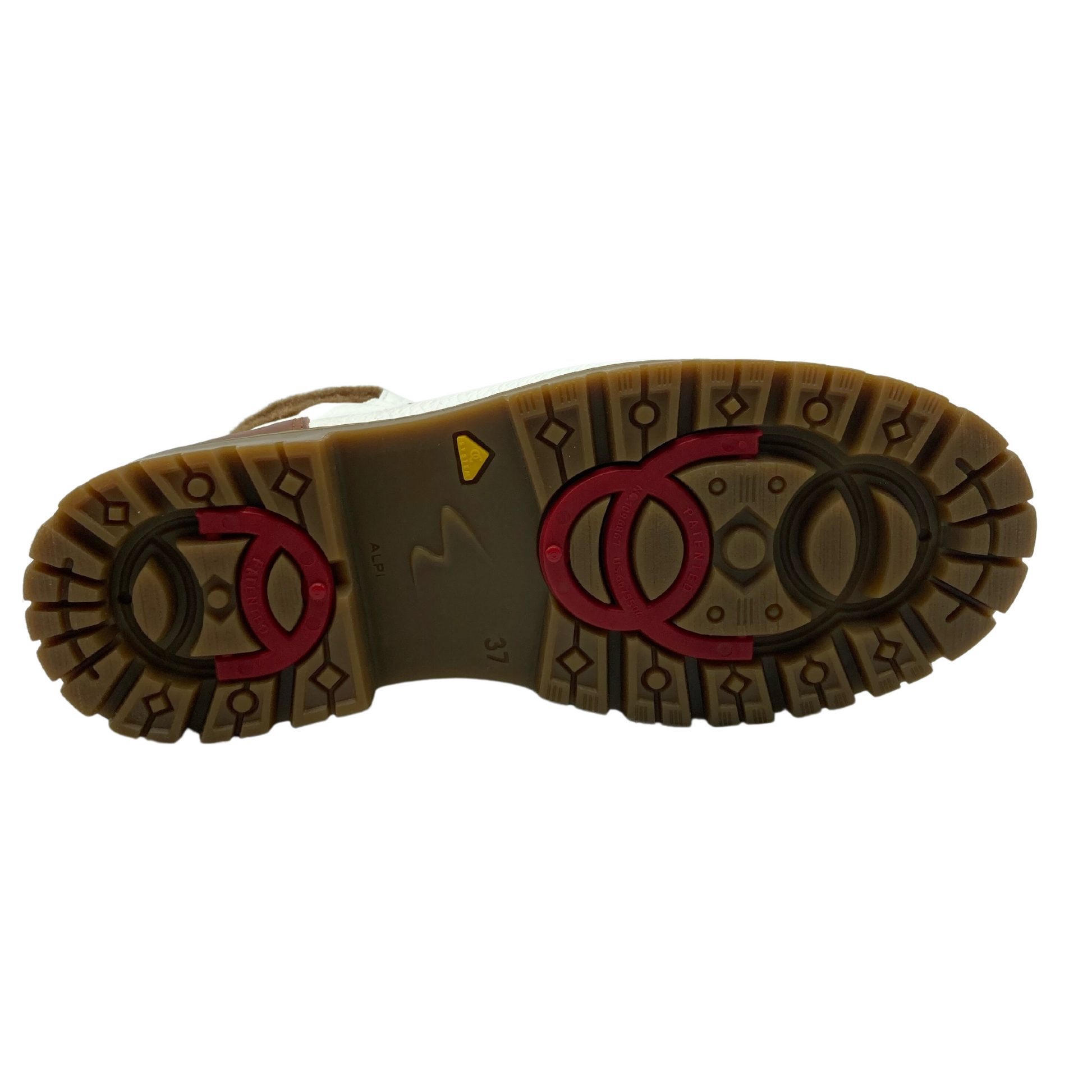 Bottom view of rubber outsole of white leather short boot