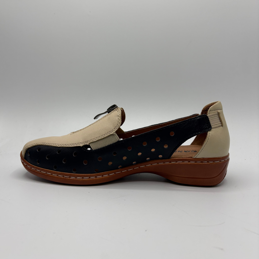 Beige and brown shoe with black sole on a white background