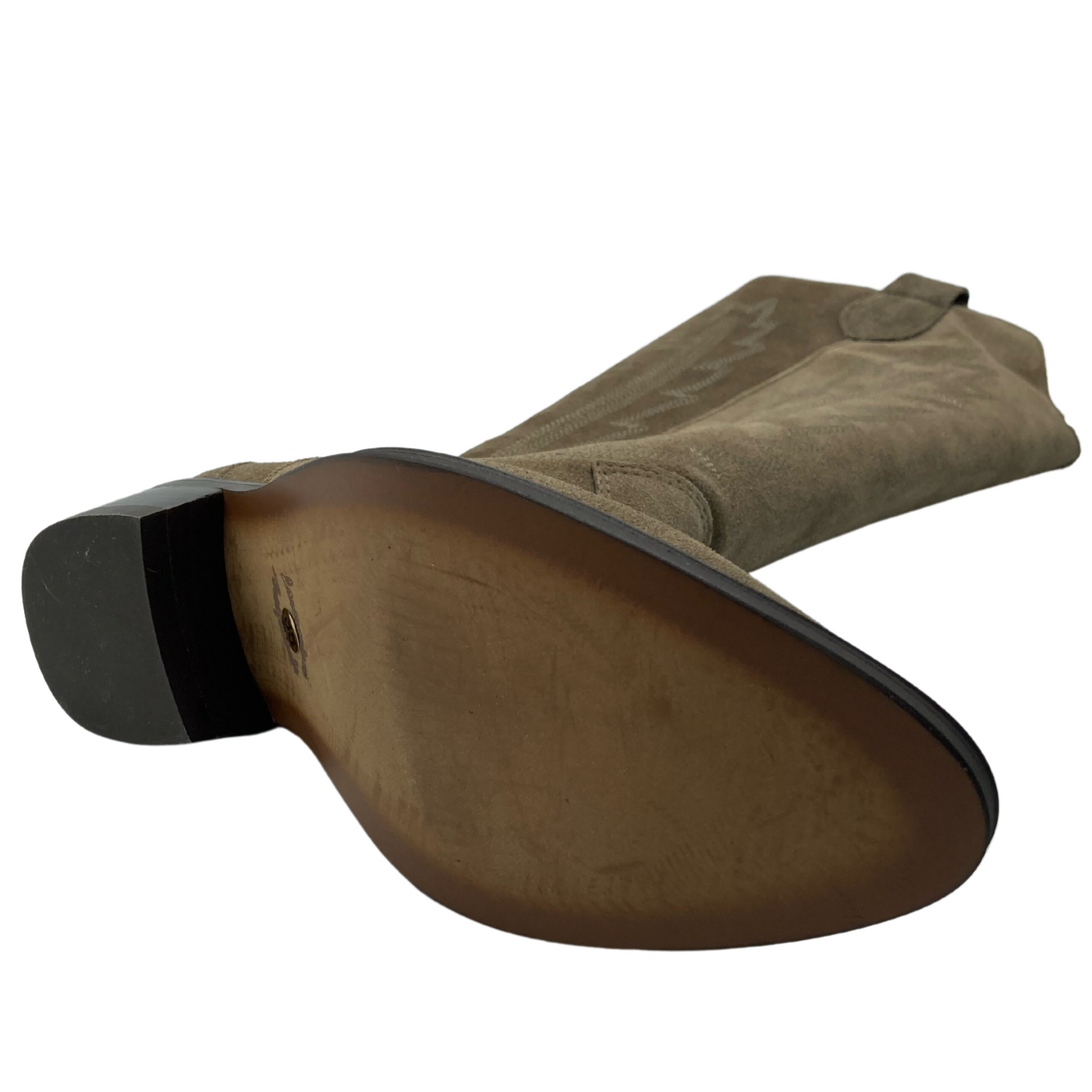 Bottom view of light brown cowboy boot with brown sole and low heel