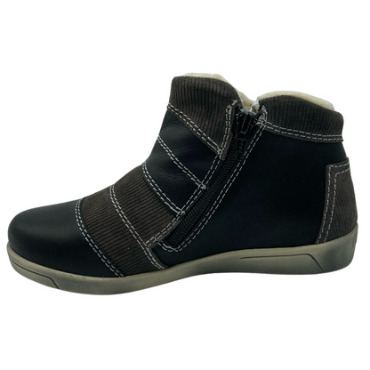 Left facing view of patchwork leather ankle boot with side zipper closure and rubber outsole