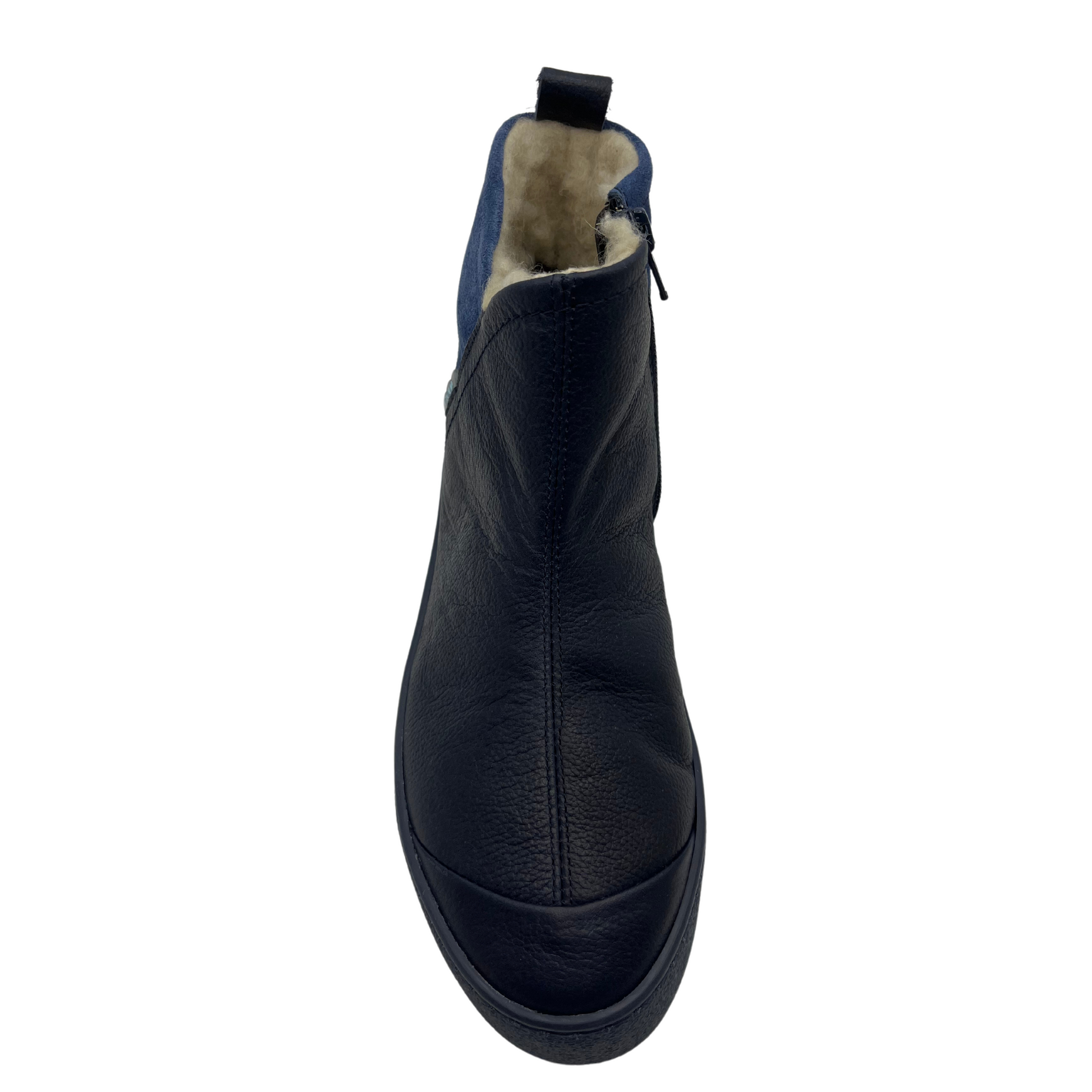 Top view of leather and suede ankle boot. Shearling lined, side zipper closure and pull on heel tab.