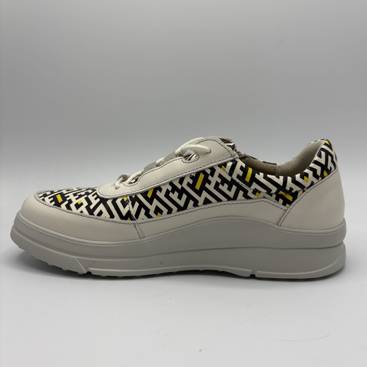 Sneaker with geometric pattern on a gray background