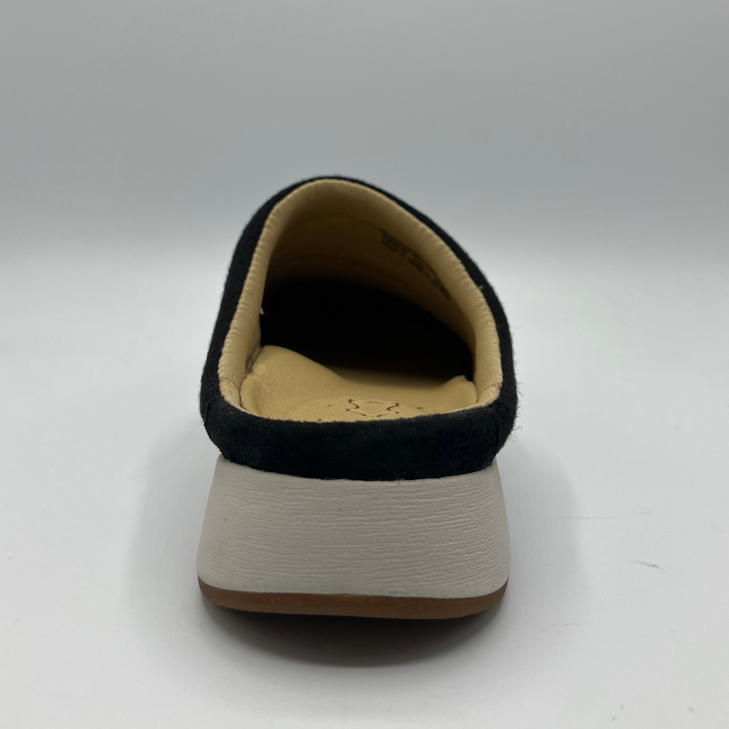 Black and beige slipper on a white background