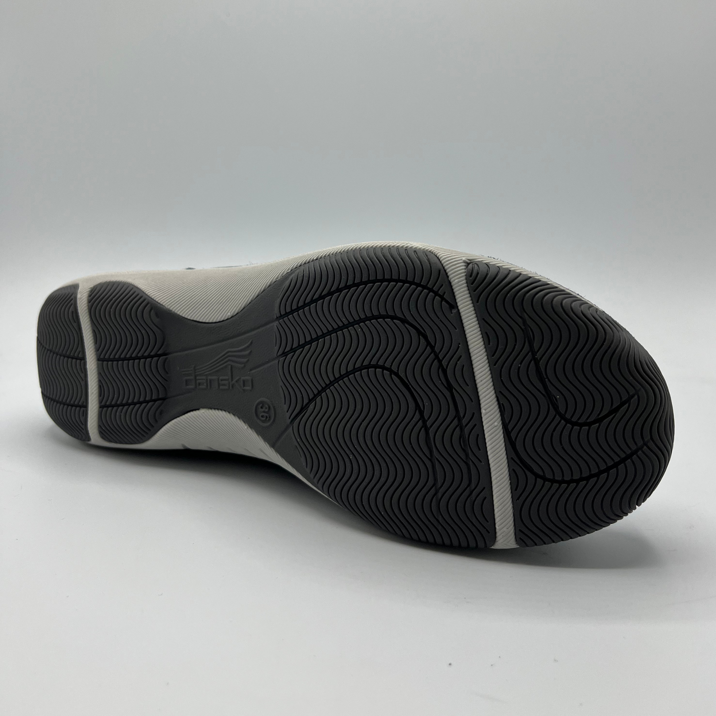 Sole of a shoe with tread pattern on a white background