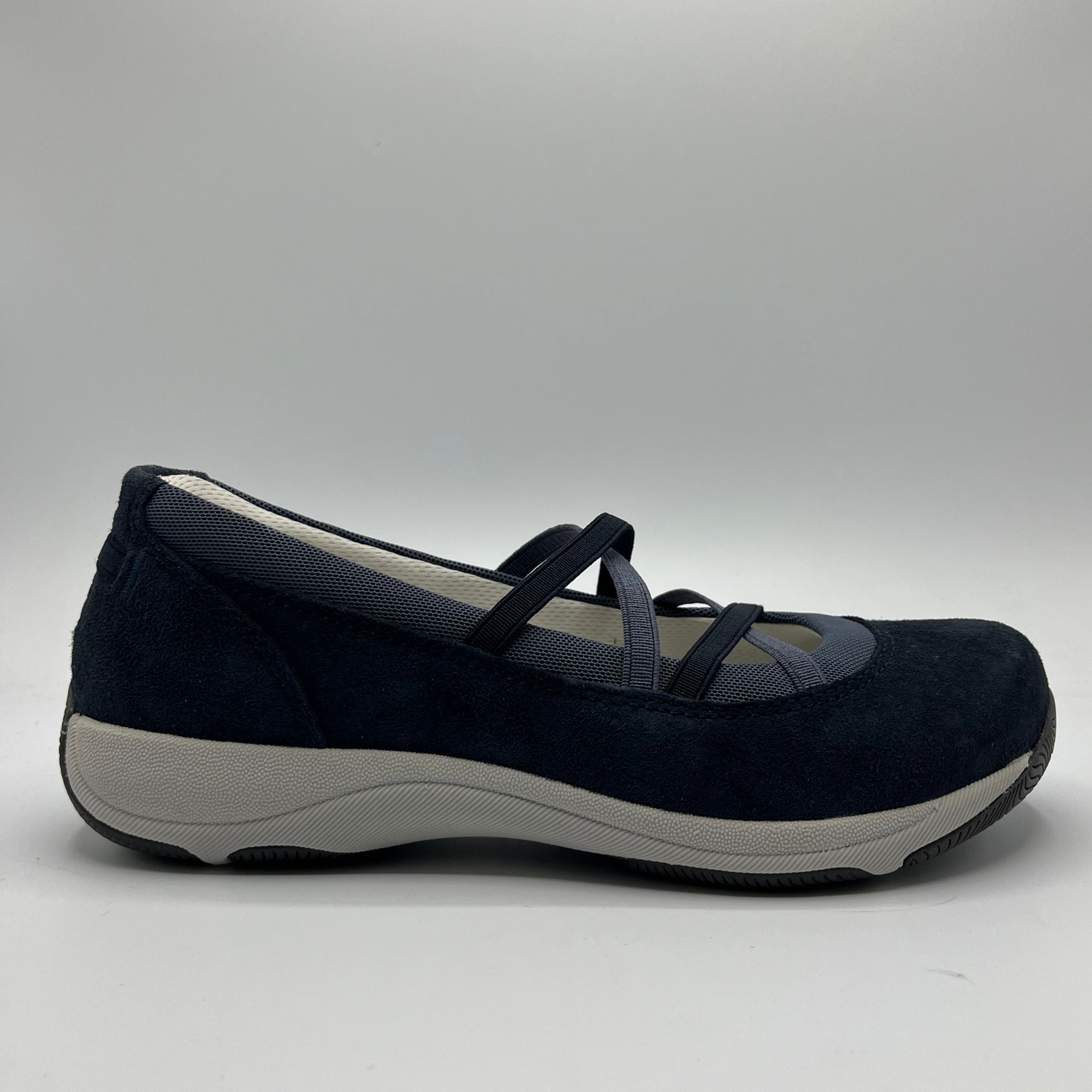 Navy blue shoe with gray sole on a light gray background