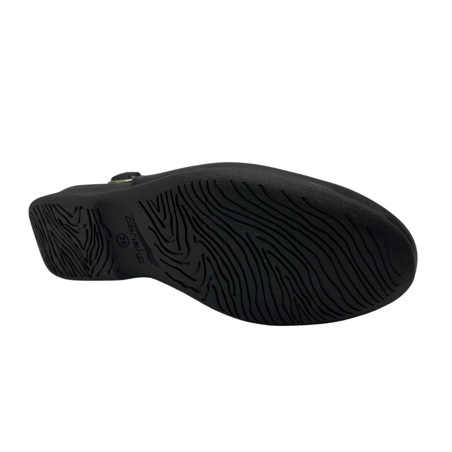 Bottom view of a black leather flat with an adjustable slingback strap and closed, rounded toe.