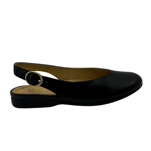 Right facing view of a black leather flat with an adjustable slingback strap and closed, rounded toe.