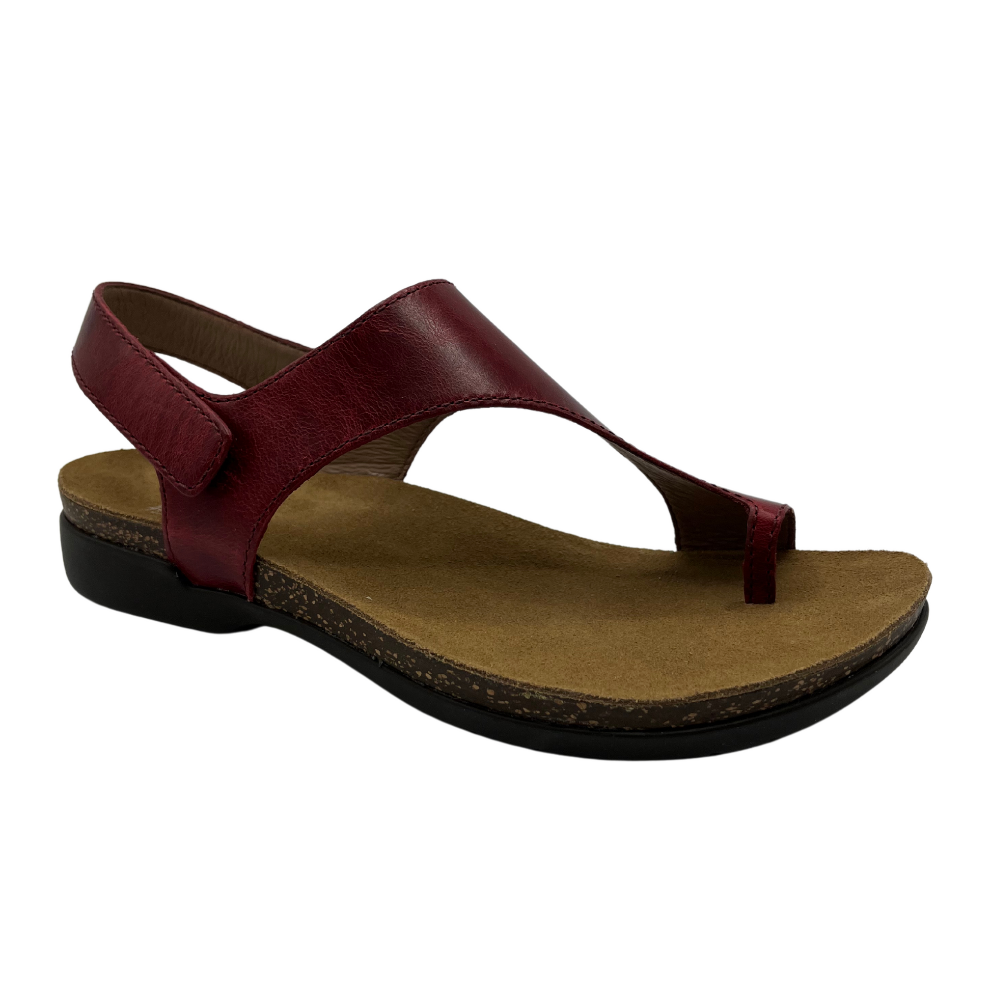 45 degree angled view of dark red leather sandal with velcro ankle strap and thin toe strap