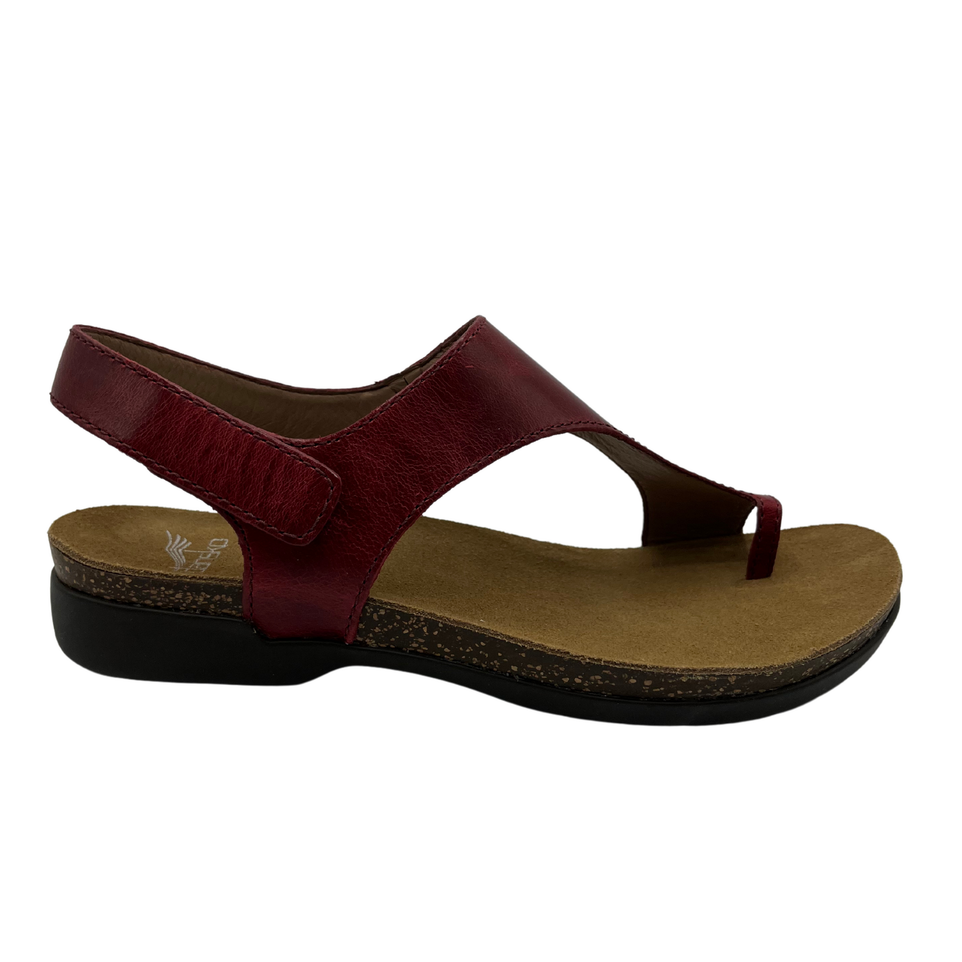 Right facing view of dark red leather sandal with velcro ankle strap and thin toe strap