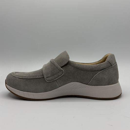 Gray shoe with a strap on a gray background