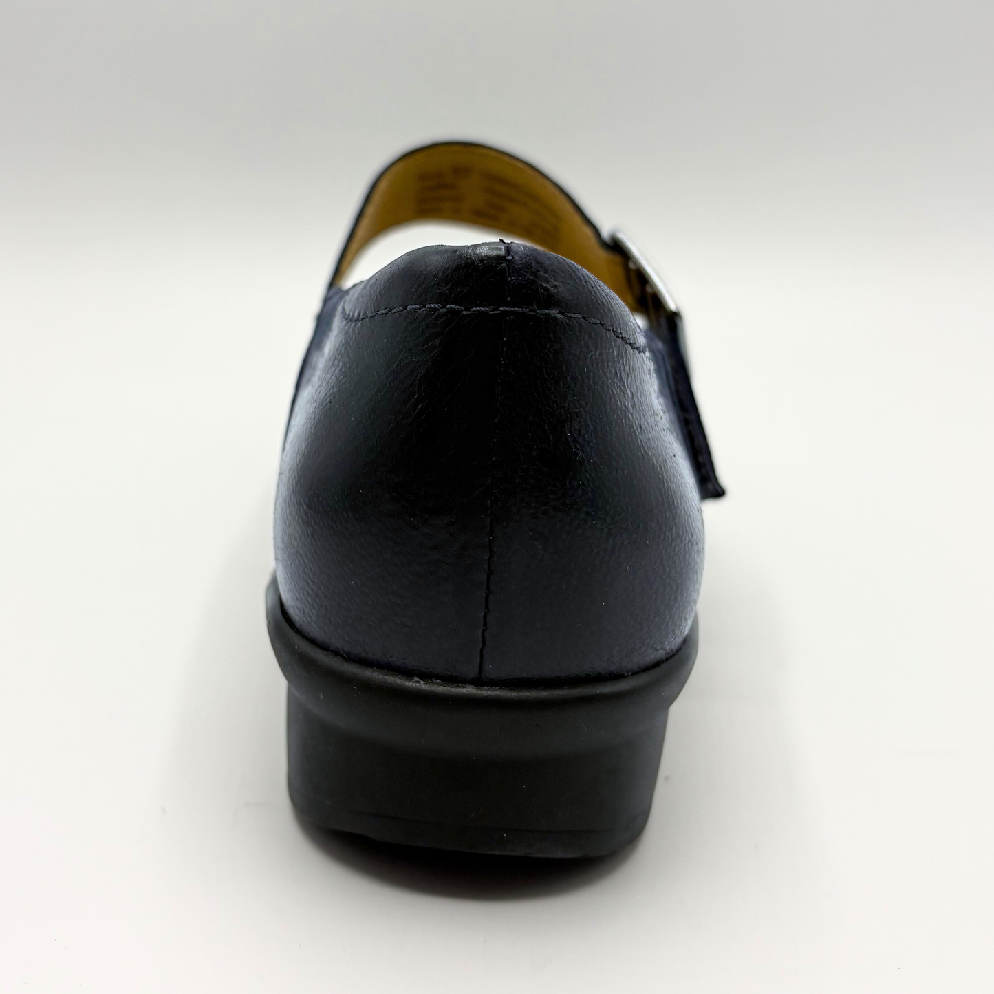 Black leather shoe on a white background