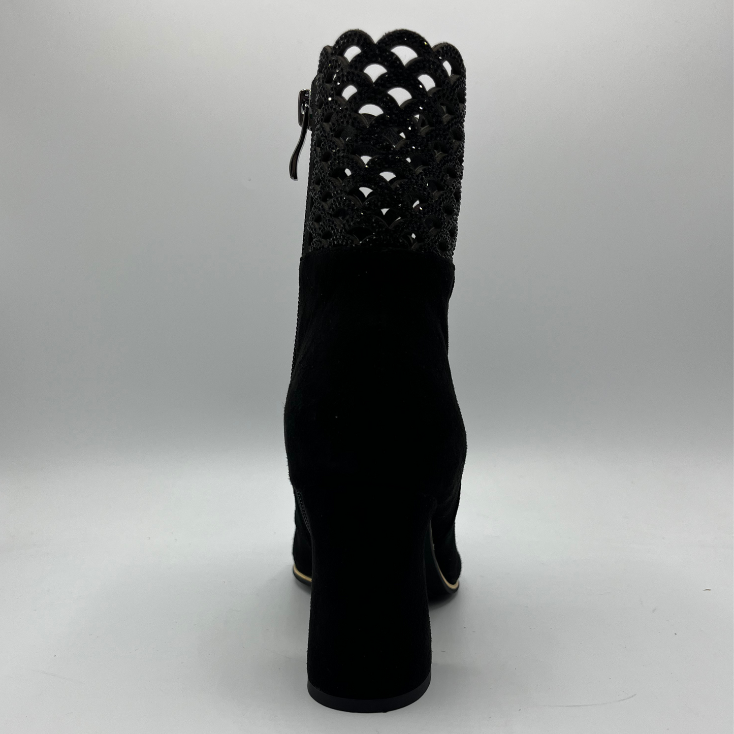 Back view of a black high heeled boot with shimmer detail
