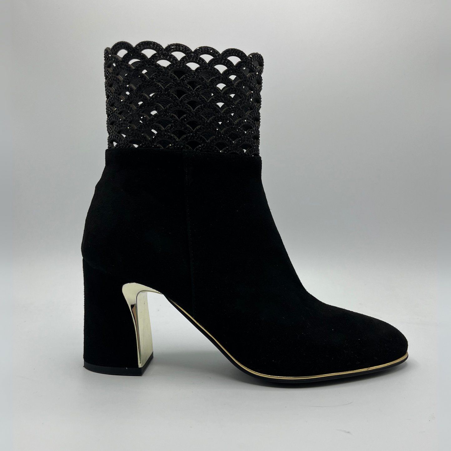 Right facing view of a black high heeled boot with shimmer detail