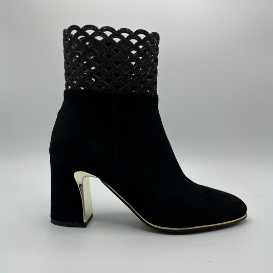 Right facing view of a black high heeled boot with shimmer detail