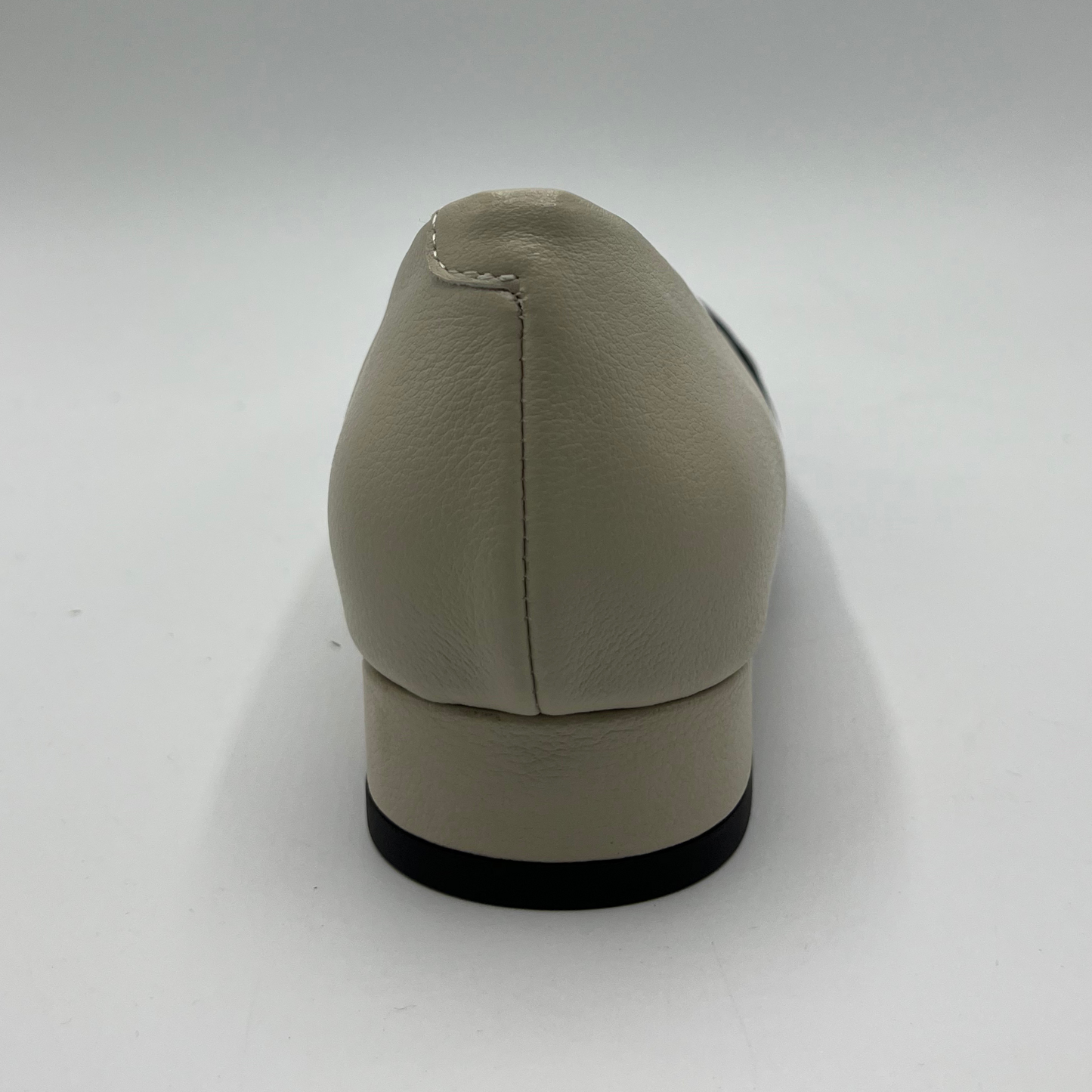 Beige shoe on a white background
