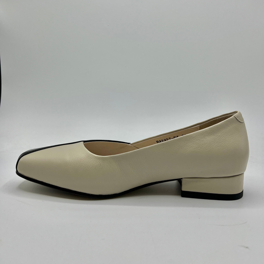 Beige shoe with black trim on a white background