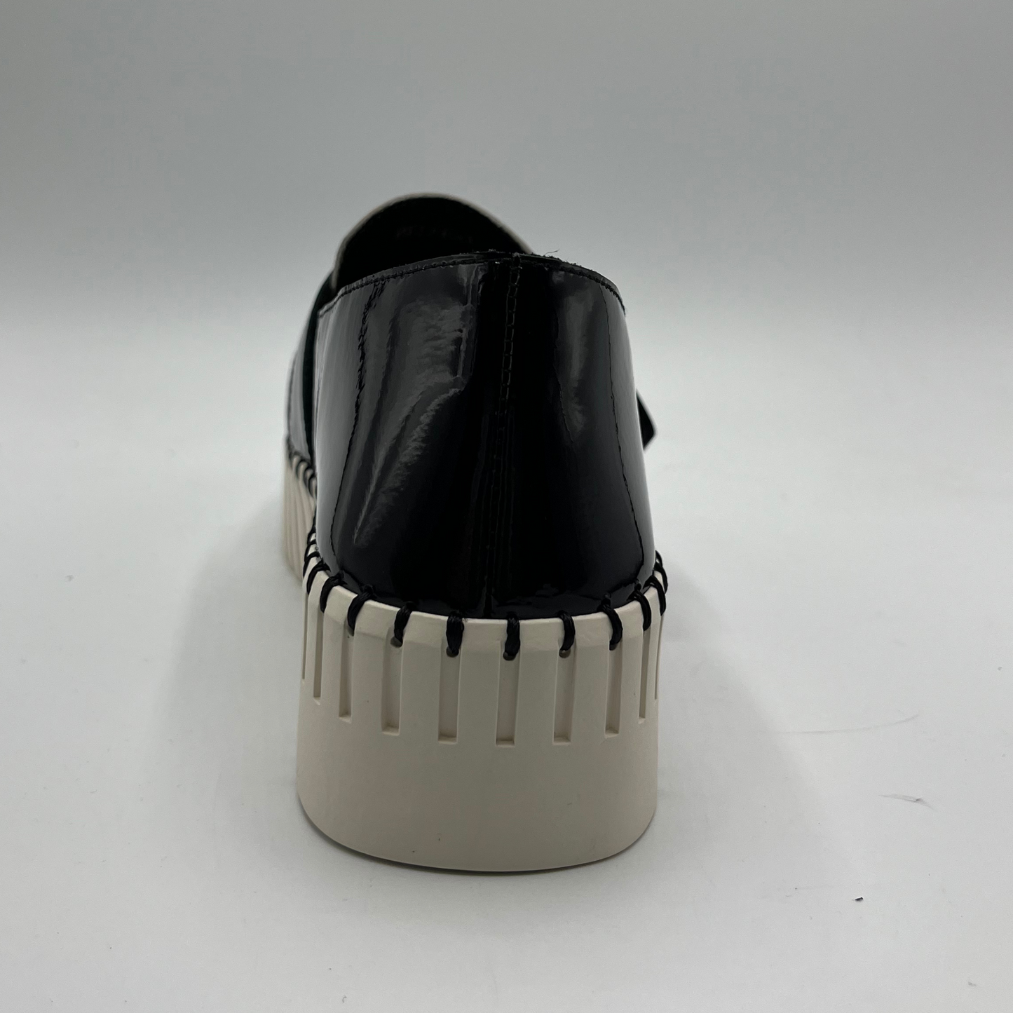 Black platform shoe on a white background