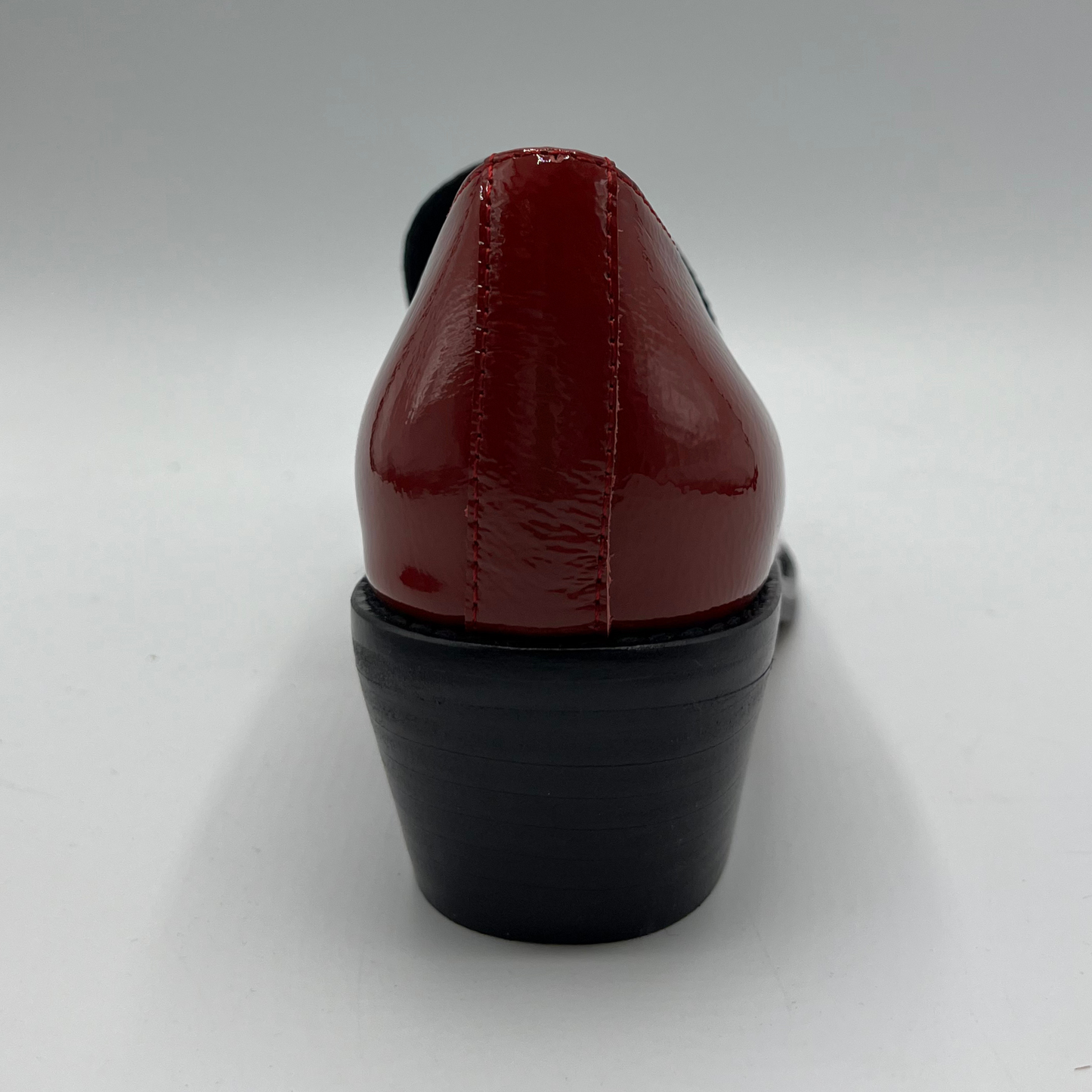 Red high-heeled shoe on a white background