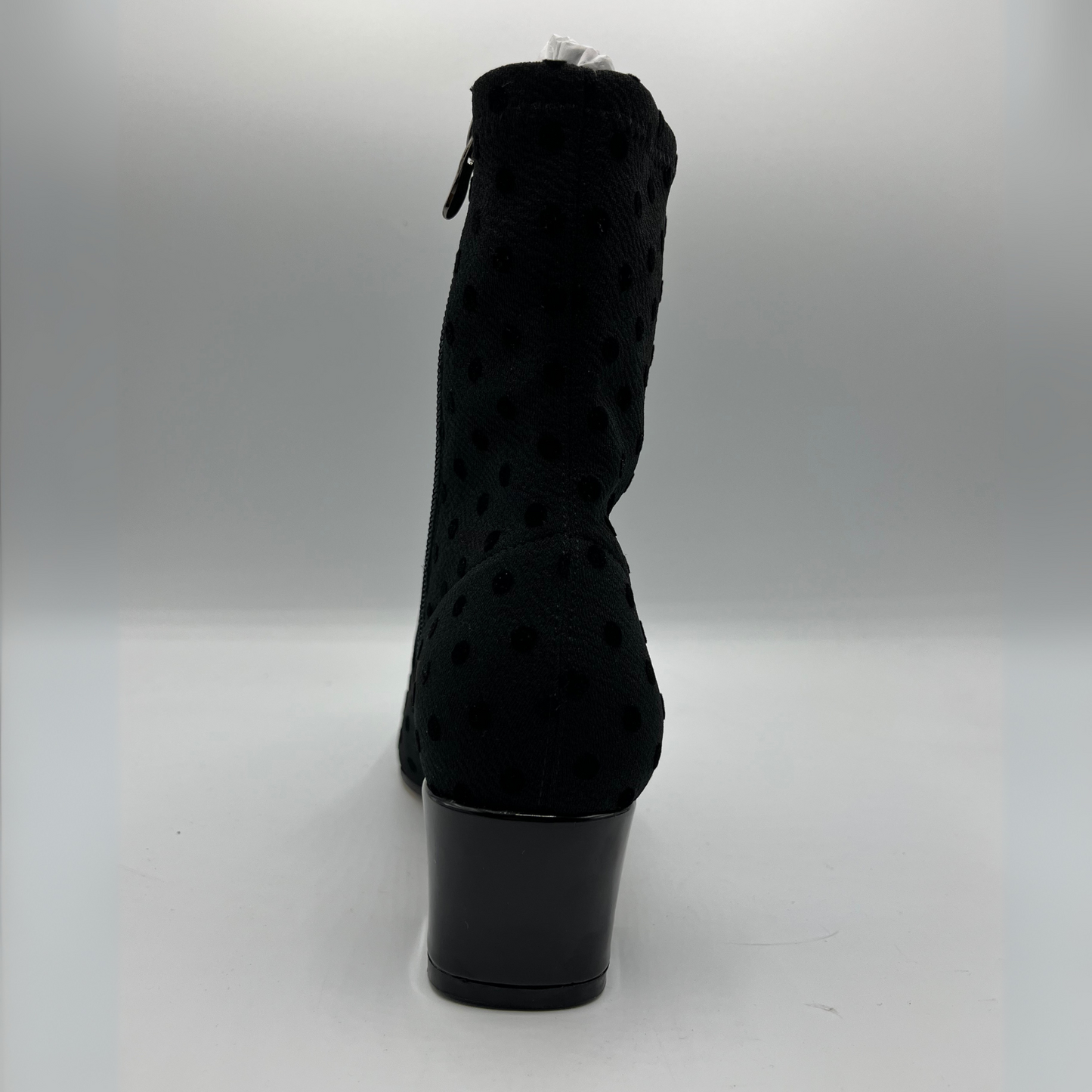 Black textured ankle boot on a white background