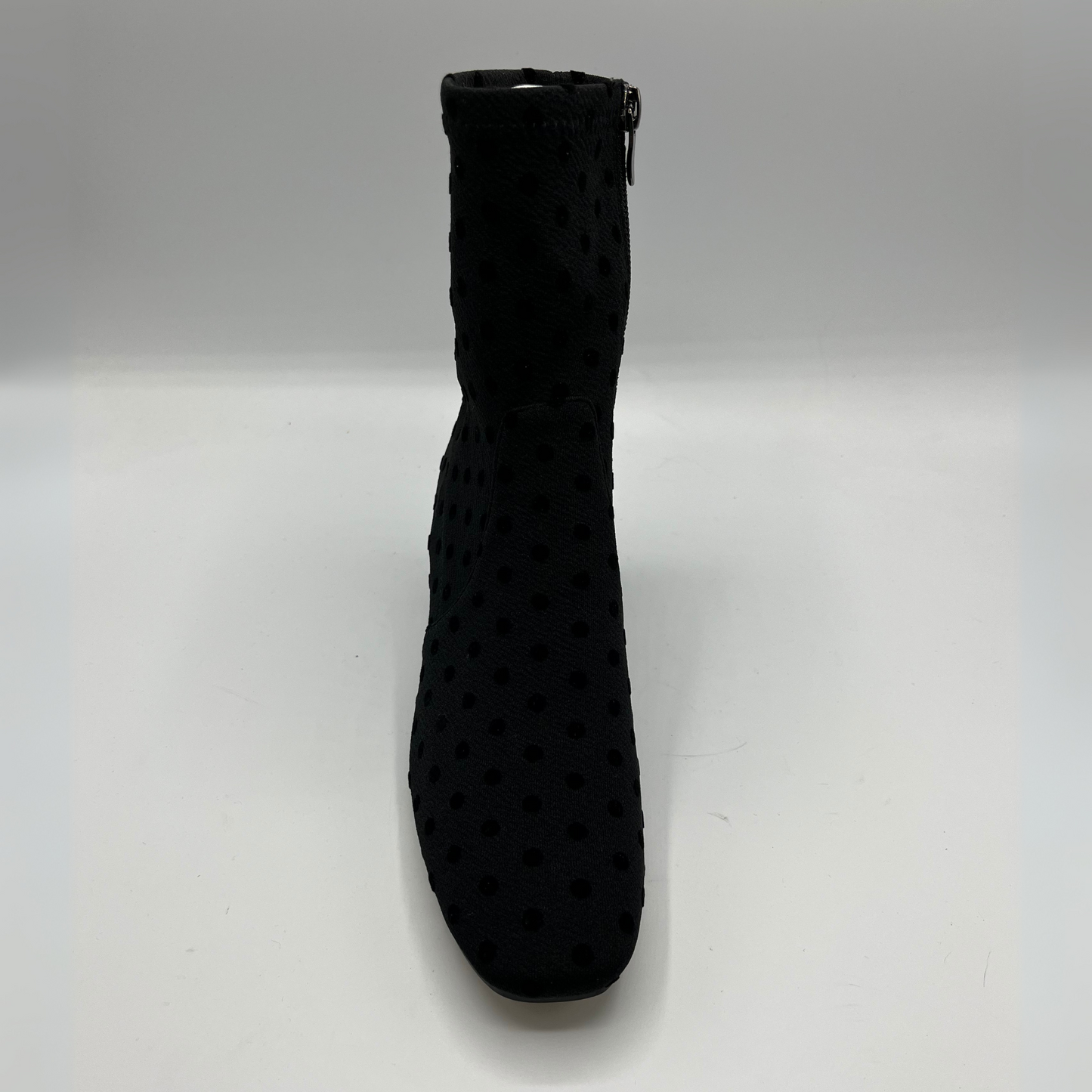 Black textured boot on a white background