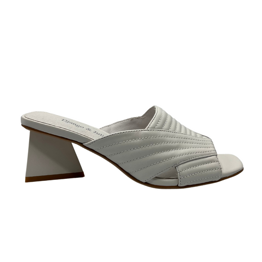 Right facing view of white leather sandal with triangular heel