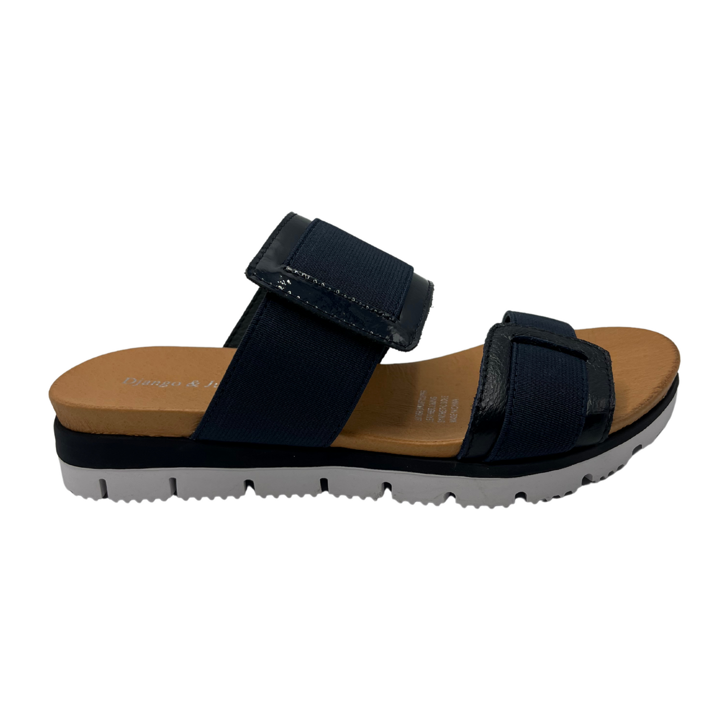 Right facing view of navy slip on sandal with a lightweight, flexible outsole.