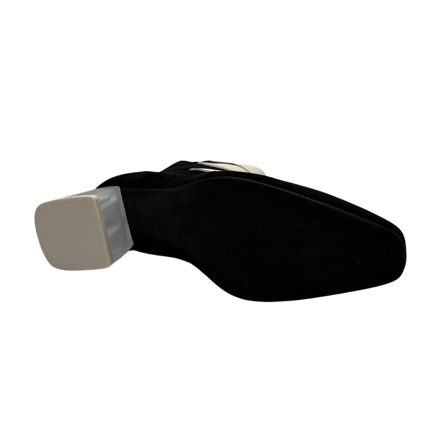 Bottom view of black and ivory short boot with translucent block heel, soft pointed toe and back zipper closure