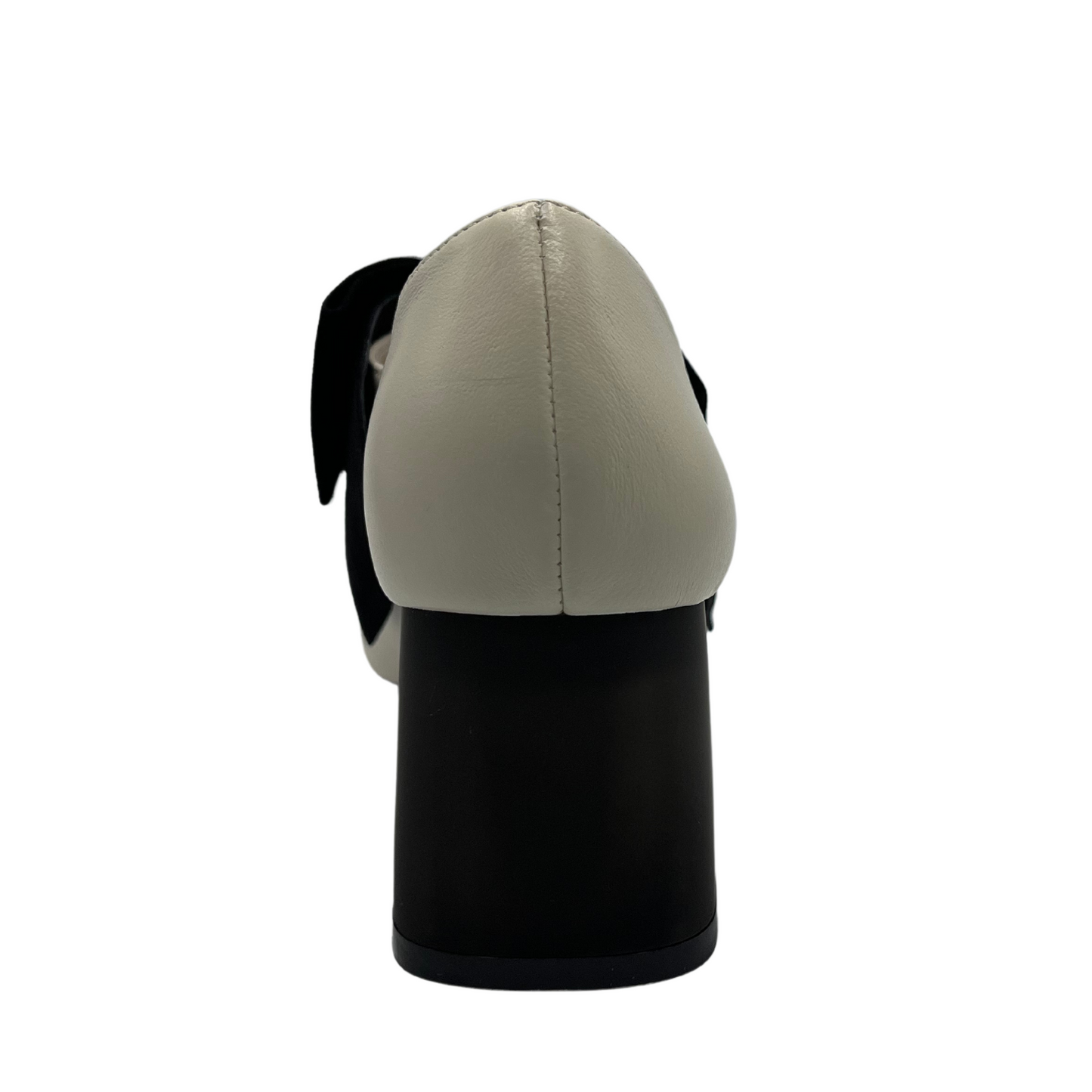 Back view of cream leather pump with black suede accent bow and short block heel