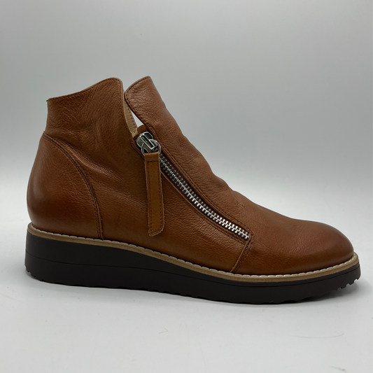 Brown leather ankle boot with a zipper on a white background