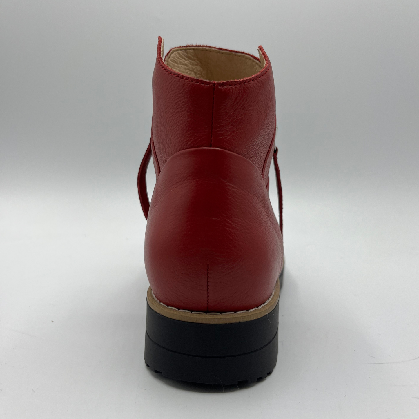 Red leather boot on a white background