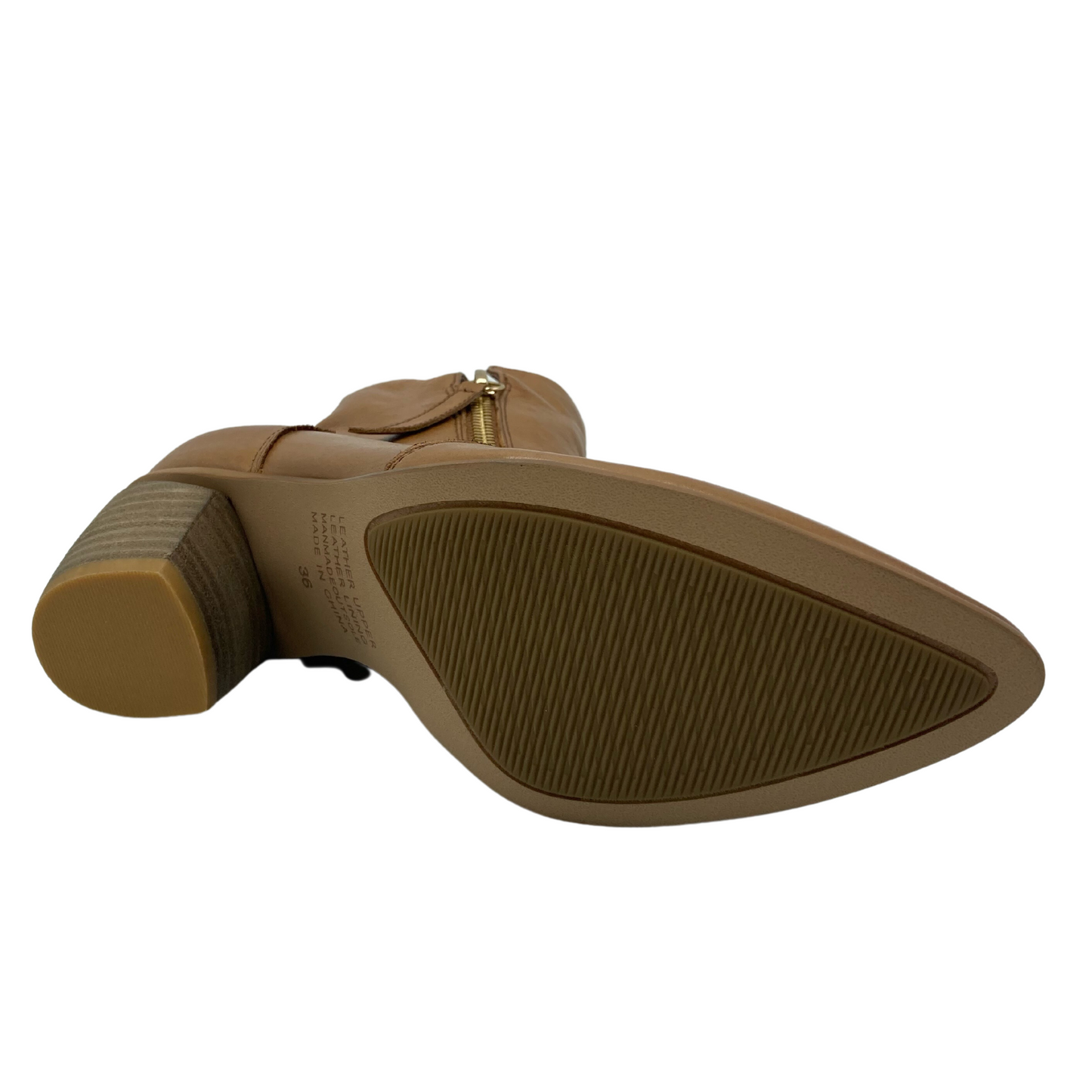 Bottom view of sole of leather boot with pointed toe and chunky heel