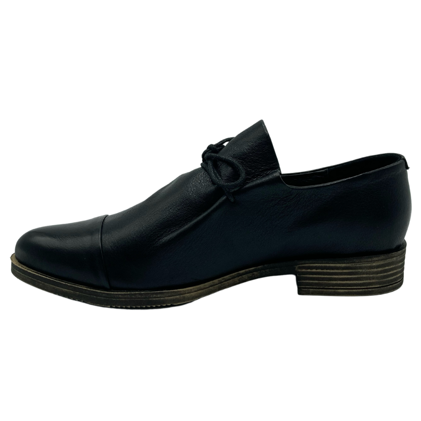 Left facing profile view of Black leather shoe with grey brown sole and heel