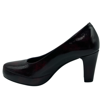 Left facing view of patent leather pump with rounded toe