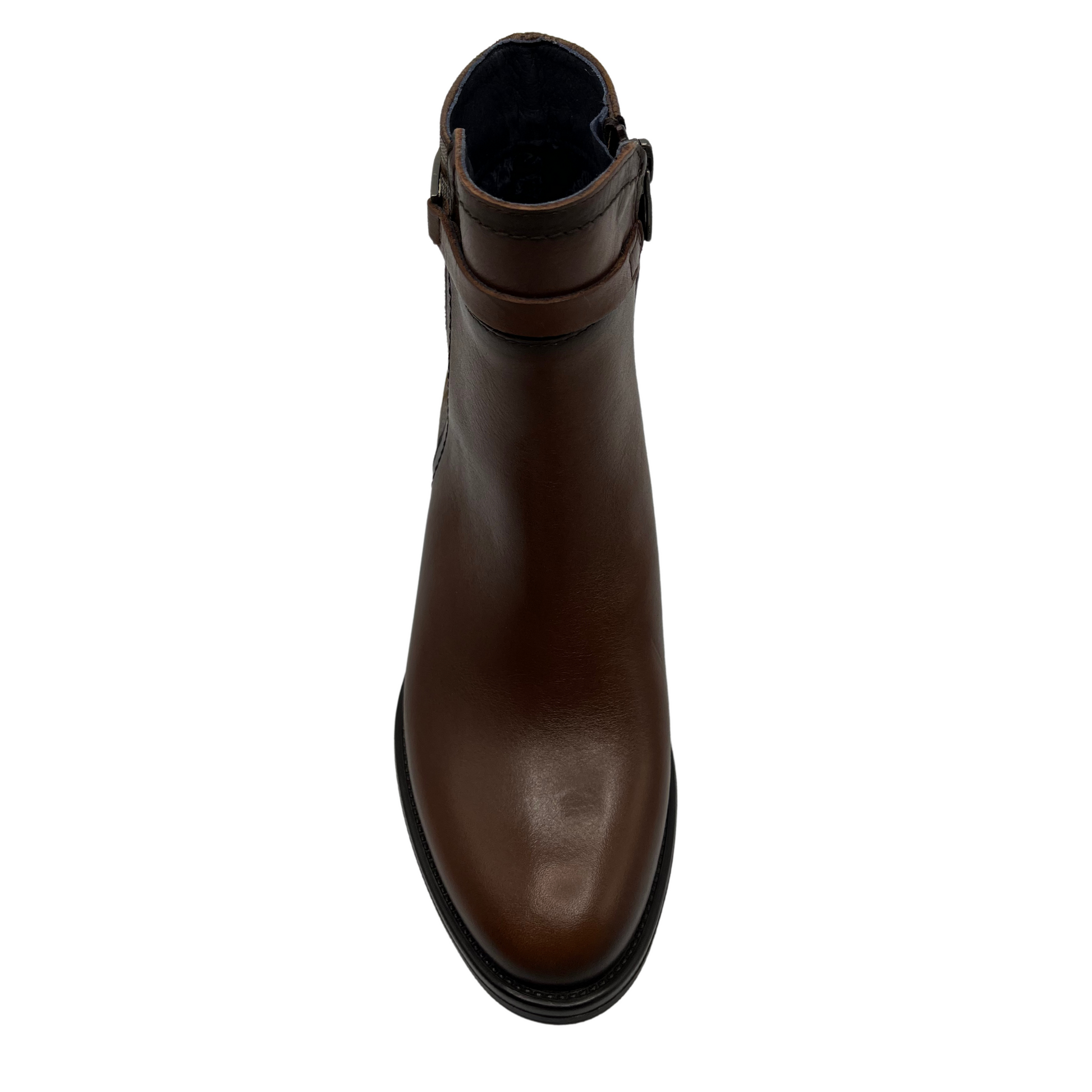 Top view of brown leather short boot with decorative ankle strap, short block heel and printed pattern on the ankle
