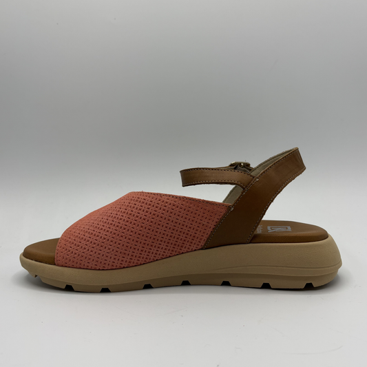 Brown sandal with a textured strap on a white background