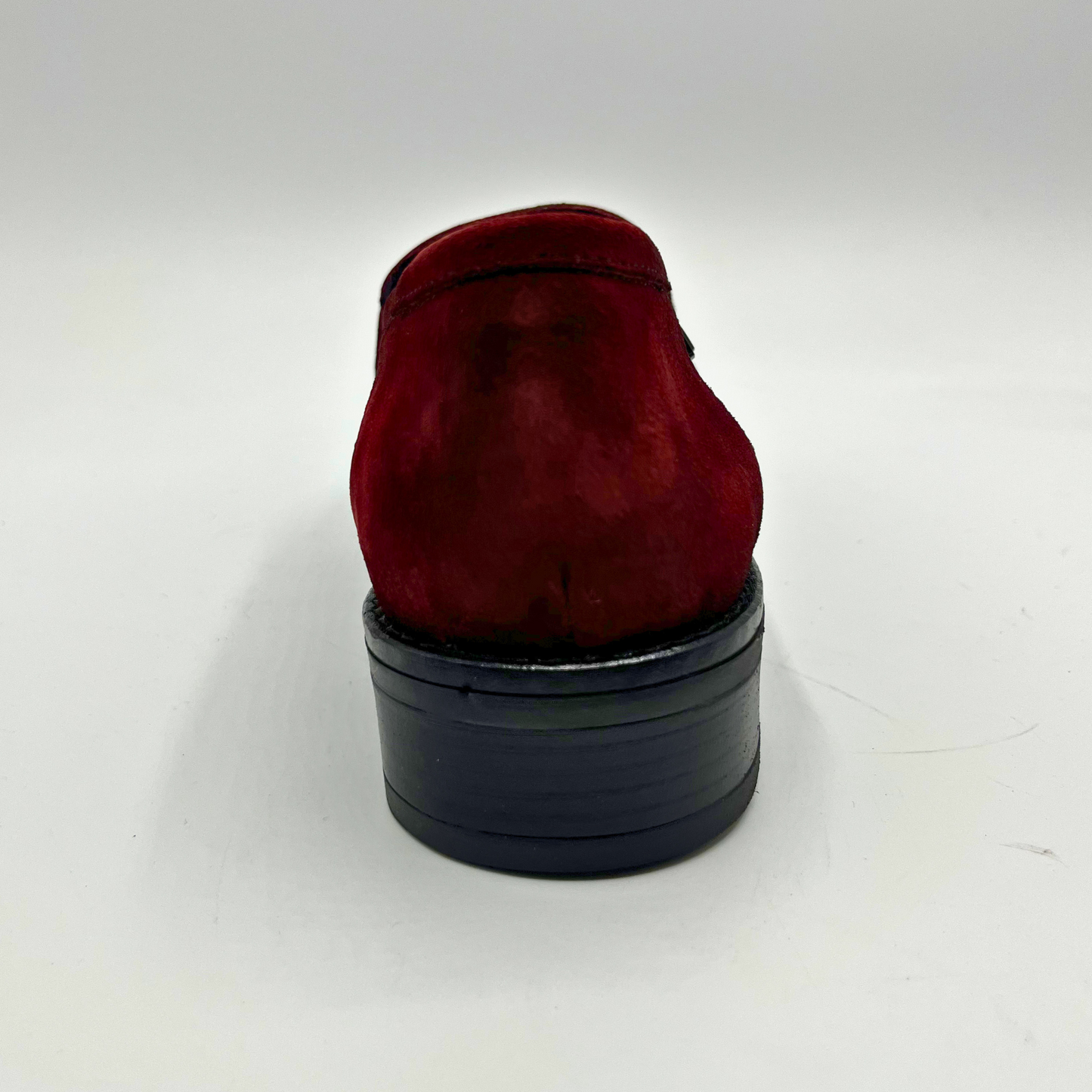 Red loafer shoe on a white background