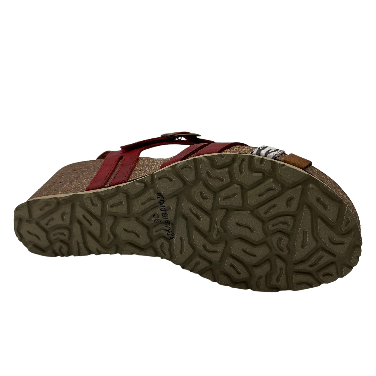 Bottom view of brown and metallic leather strapped sandal with rubber outsole