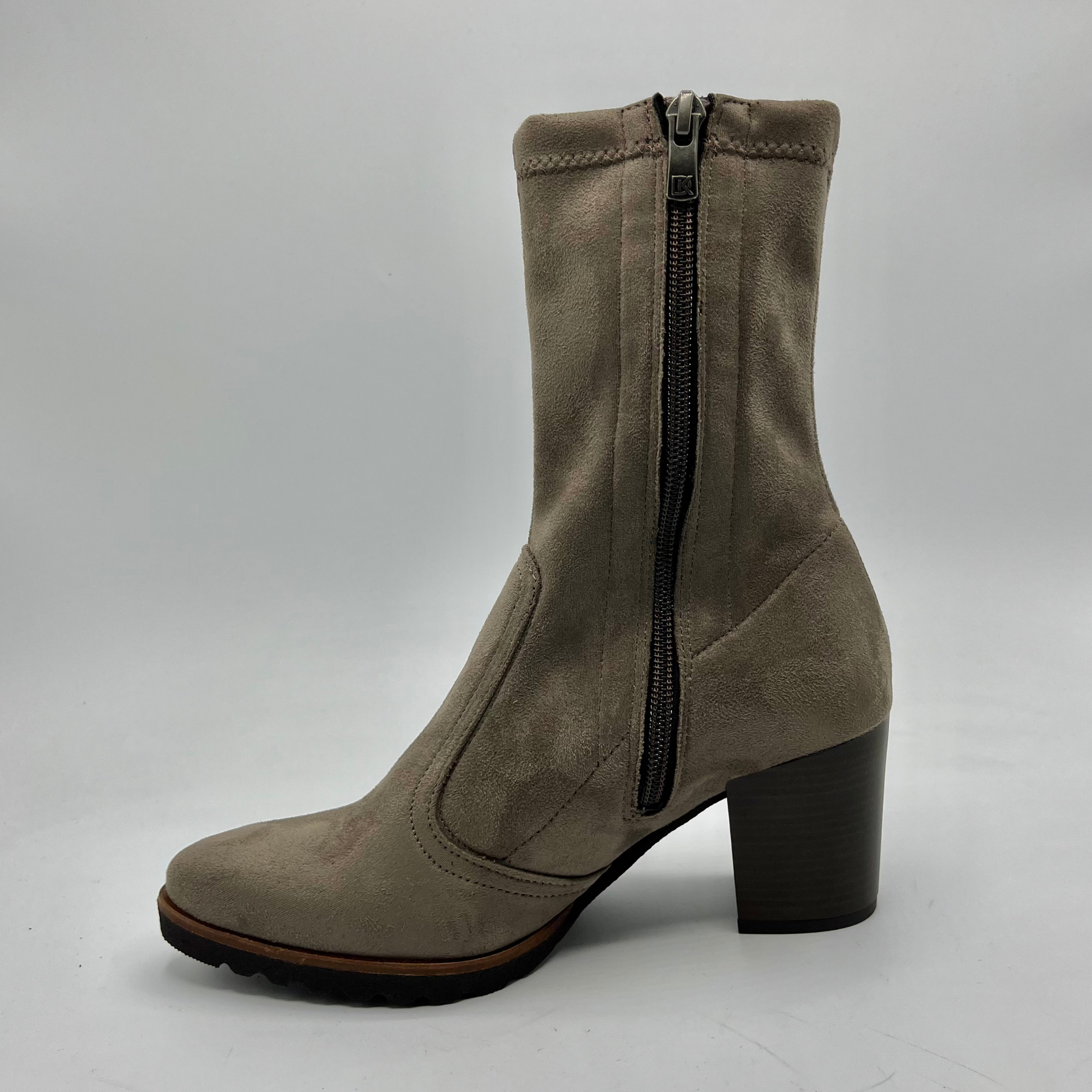 Taupe ankle boot with a zipper on a white background