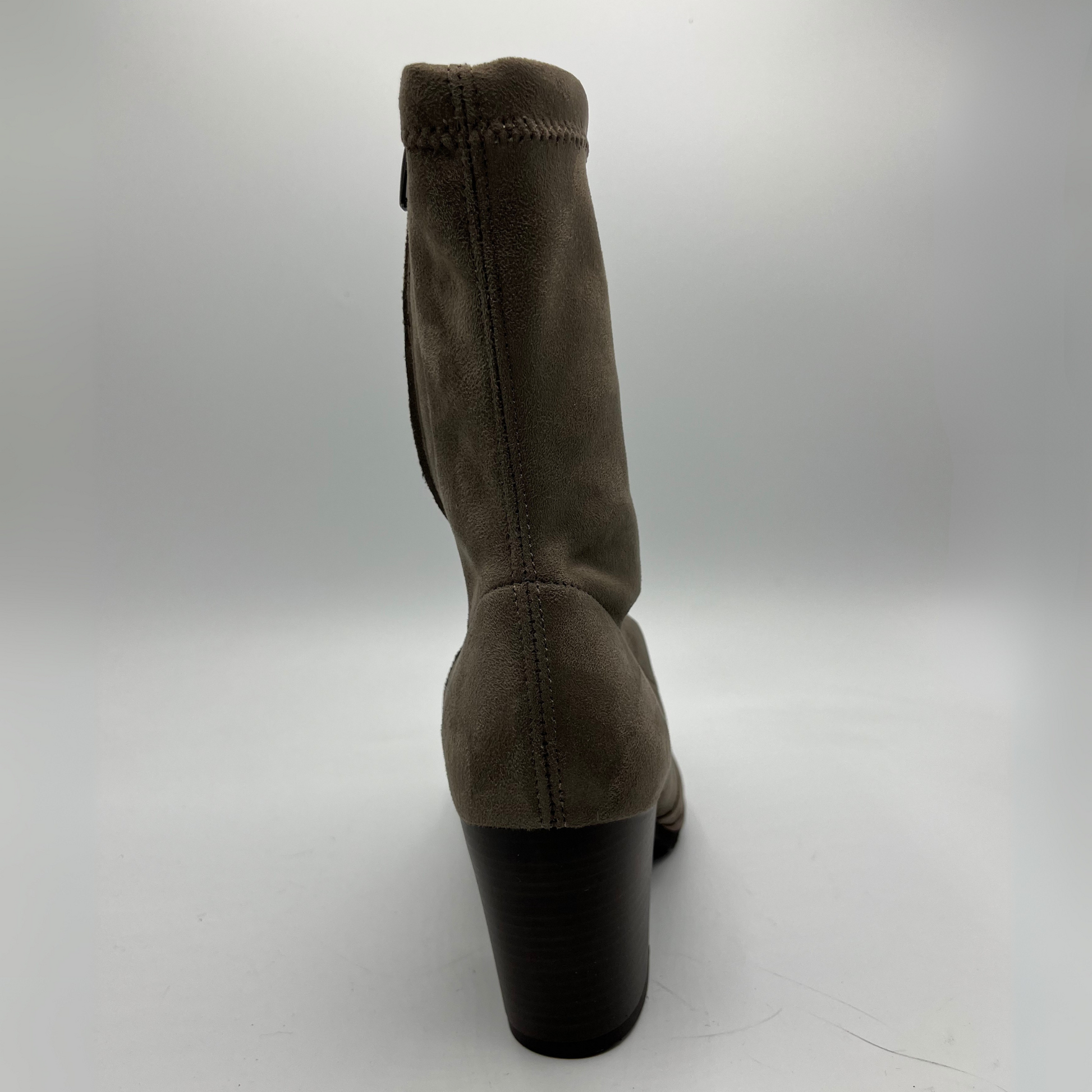 Taupe boot with a black heel on a white background