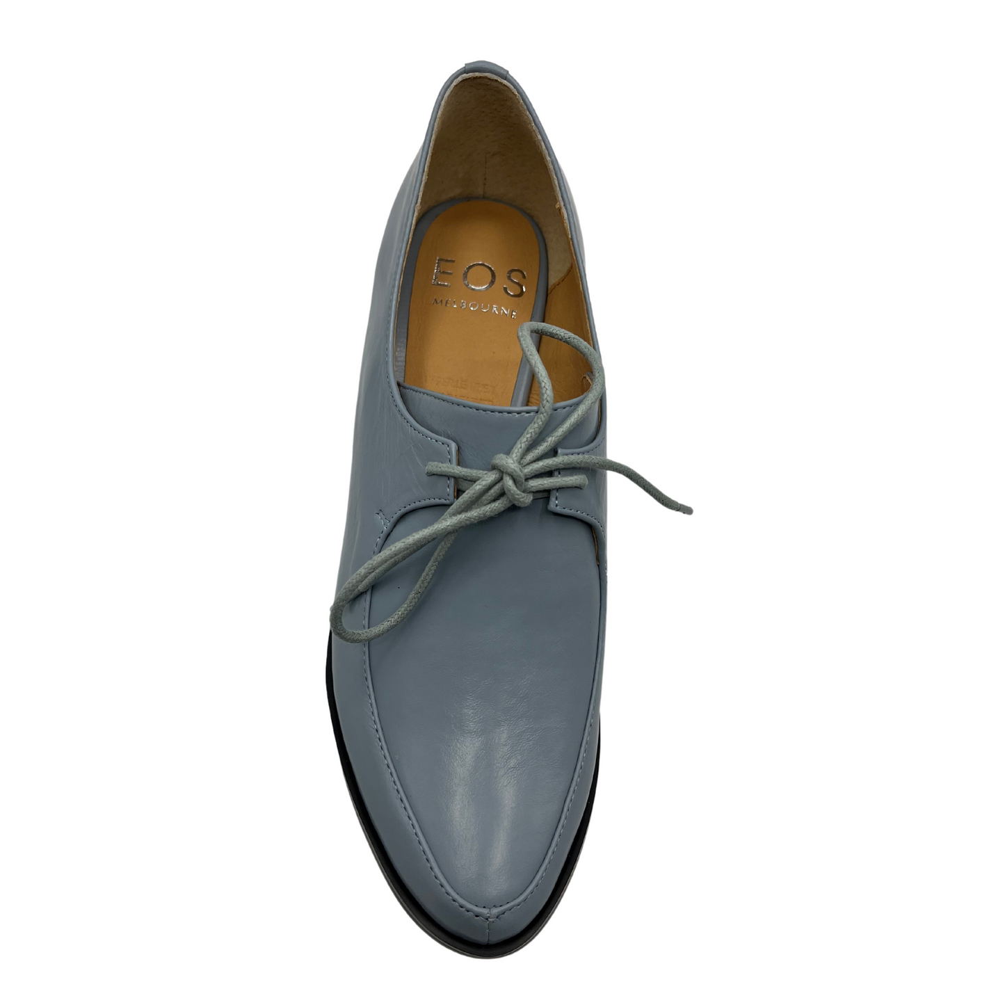 Top view of a blue leather derby shoe with leather lining, wrapped block heel and ingle eyelet laces.