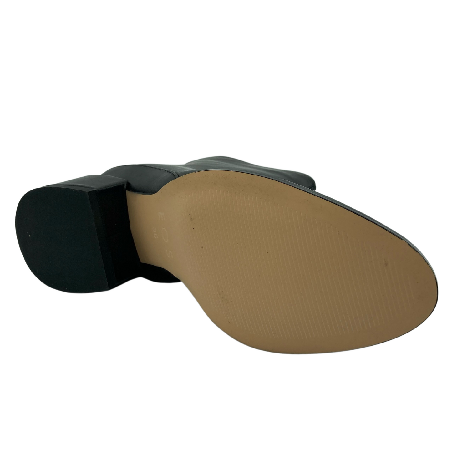 View of the bottom of a short black ankle boot with block heel and rounded pointed toe
