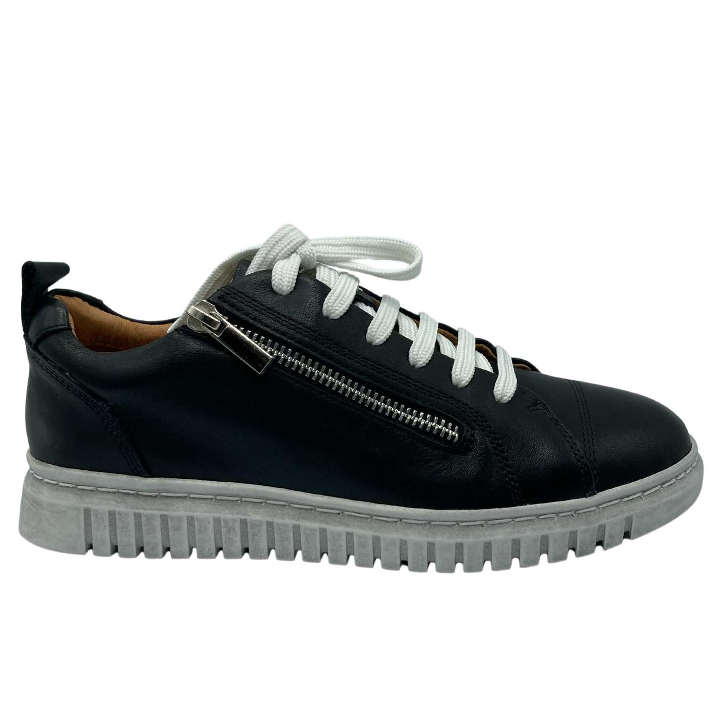 Right facing view of black leather sneaker with side zipper closure, white laces and rubber outsole