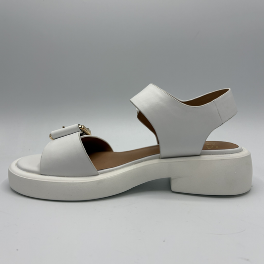 White sandal with a platform sole on a gray background