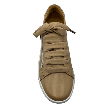 Top view of nude leather sneaker with matching laces and white rubber outsole